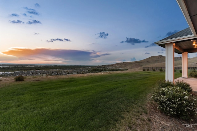 5557 E Hootowl Dr, Boise, ID 83716 - yard at dusk with a mountain view and a view of rural / pastoral area