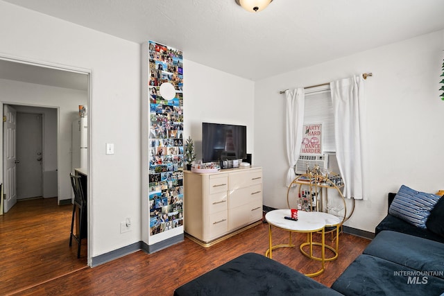 living room featuring dark hardwood / wood-style floors and cooling unit