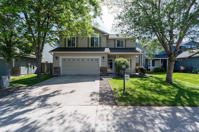 6524 S Derbyshire Ave, Boise, ID 83709 - traditional home with concrete driveway, a garage, and stone siding