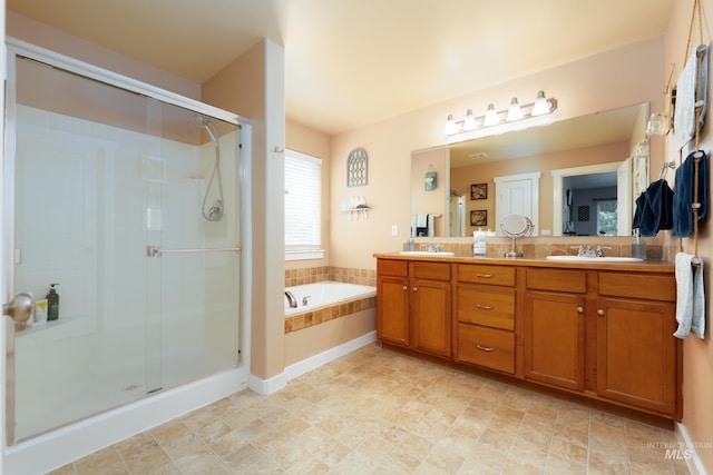 6524 S Derbyshire Ave, Boise, ID 83709 - full bathroom featuring double vanity, a bath, and a stall shower
