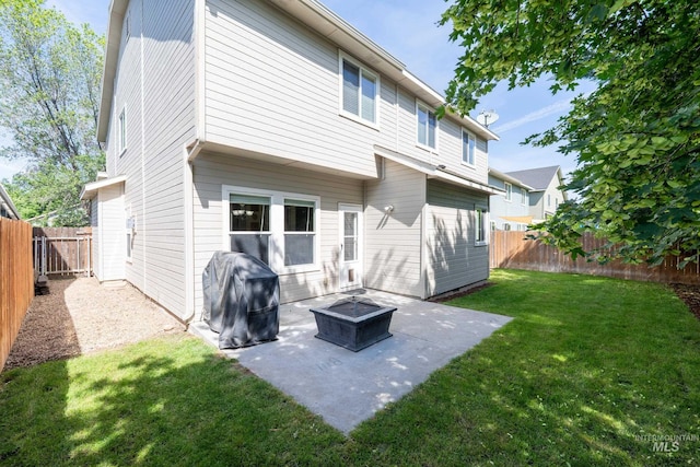 6524 S Derbyshire Ave, Boise, ID 83709 - back of house with a patio and an outdoor fire pit