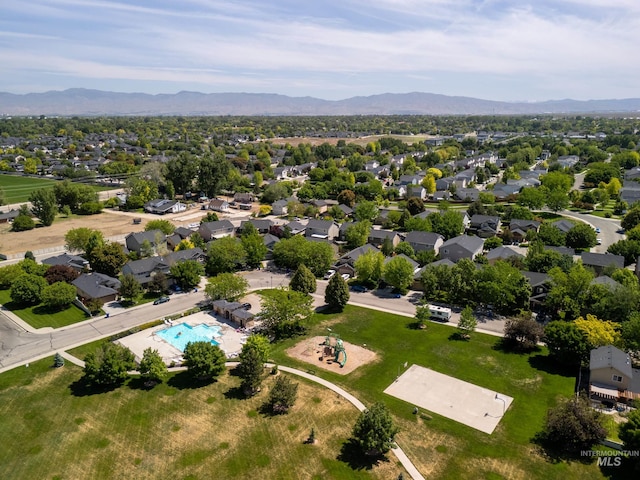 6524 S Derbyshire Ave, Boise, ID 83709 - aerial view of residential area featuring a mountain backdrop and a pool area