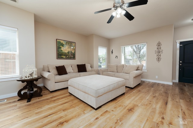 6524 S Derbyshire Ave, Boise, ID 83709 - living area featuring wood finished floors, a ceiling fan, and baseboards