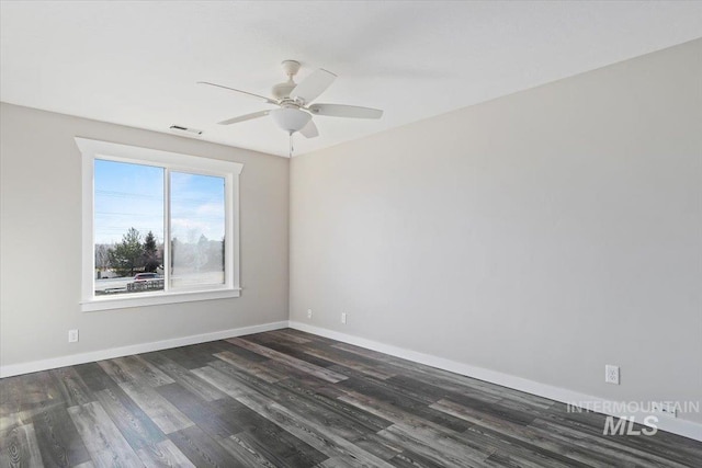 unfurnished room featuring ceiling fan and dark wood-type flooring