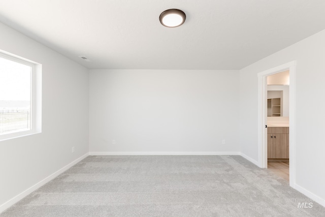 2455 W Opalite Dr, Kuna, ID 83634 - spare room featuring light carpet and baseboards