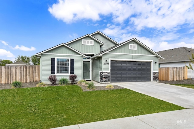craftsman-style home with board and batten siding, fence, an attached garage, and driveway