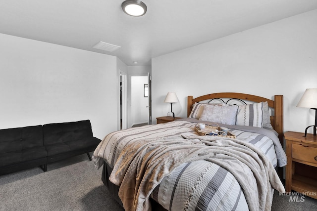 carpeted bedroom with visible vents