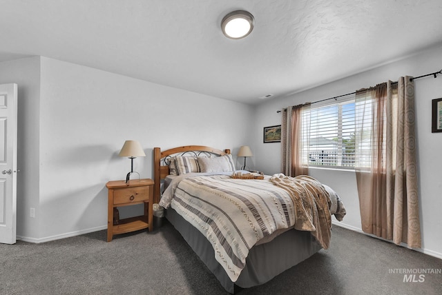 bedroom with carpet flooring and baseboards