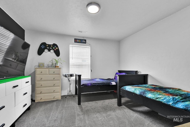 bedroom featuring visible vents and carpet