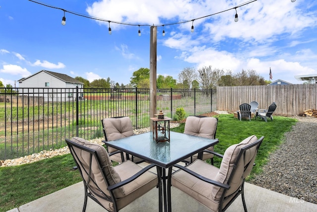 view of patio / terrace featuring fence and outdoor dining space