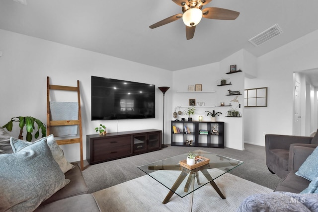 carpeted living room featuring baseboards, a ceiling fan, lofted ceiling, and visible vents