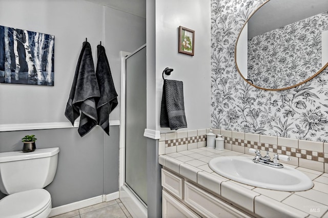 full bath with vanity, tile patterned flooring, toilet, a stall shower, and wallpapered walls
