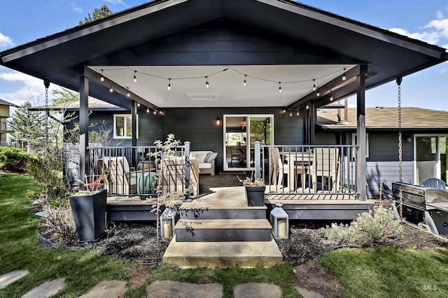 back of house with a wooden deck