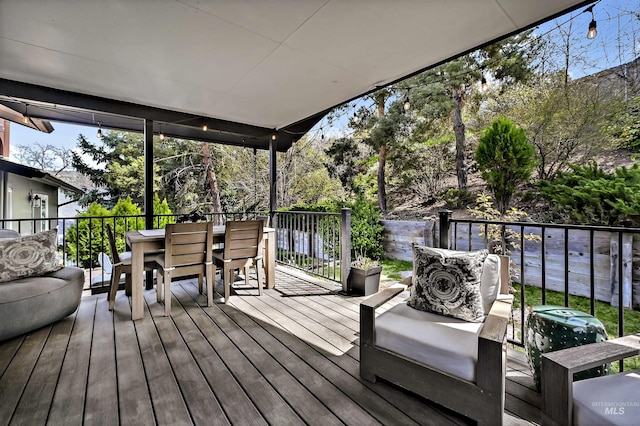 wooden deck with outdoor dining space