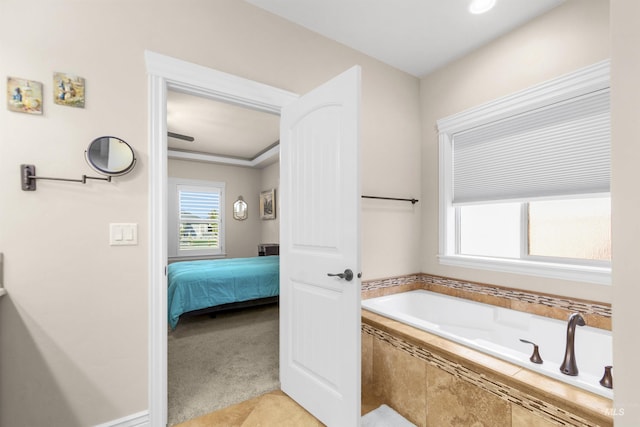 bathroom featuring ensuite bath, tile patterned flooring, and a garden tub