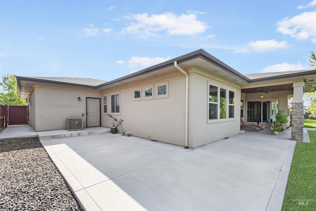 exterior space featuring stucco siding, fence, and a patio