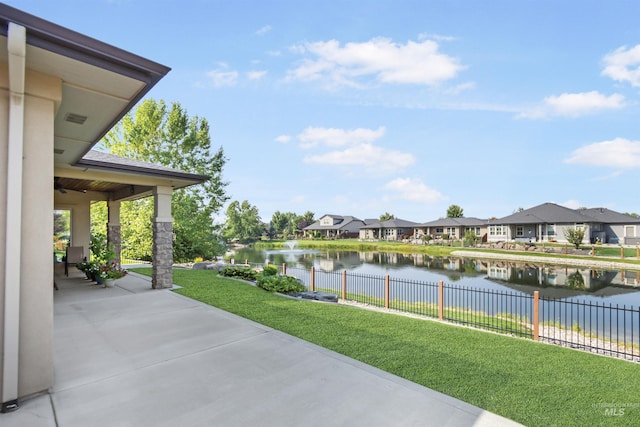 exterior space featuring a residential view and fence