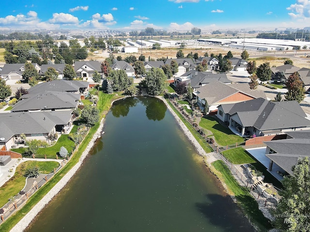 aerial view with a water view and a residential view