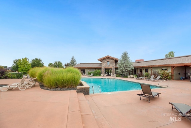 pool with a patio