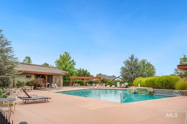 pool featuring a patio area and a pergola