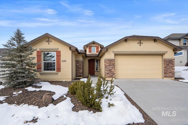 view of front of property featuring stone siding, driveway, an attached garage, and stucco siding