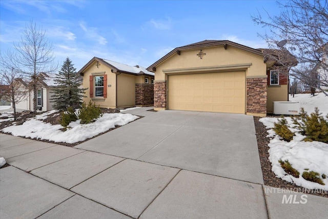 single story home with an attached garage, stone siding, concrete driveway, and stucco siding