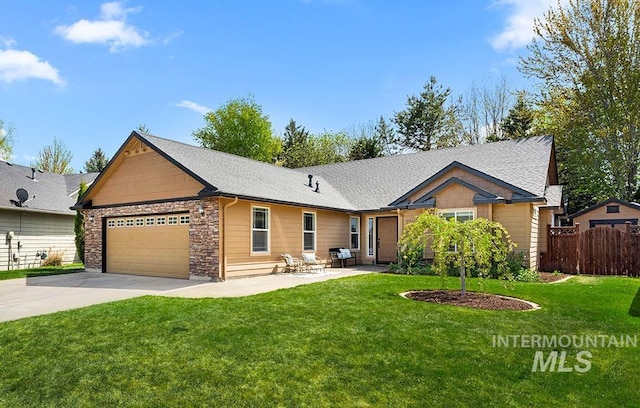 2381 E Satterfield St, Meridian, ID 83646 - view of front facade featuring a garage, concrete driveway, and stone siding