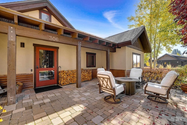 view of patio with an outdoor fire pit