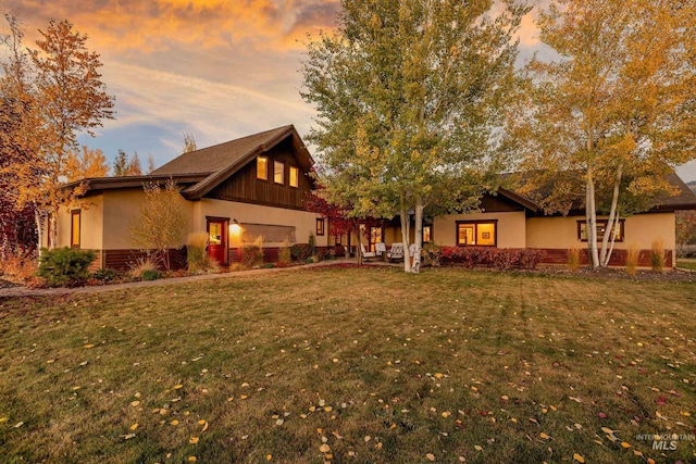 view of front of home with a lawn