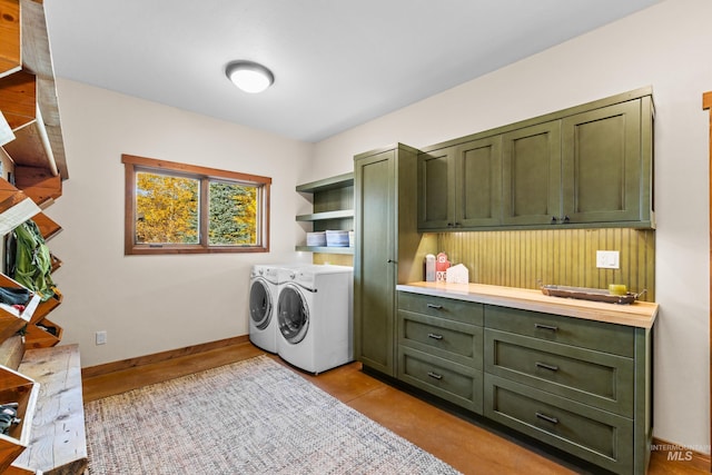 laundry area with cabinets and independent washer and dryer