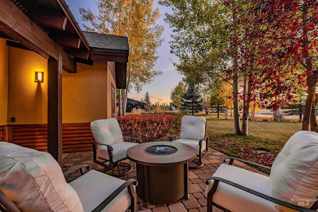 patio terrace at dusk with an outdoor fire pit