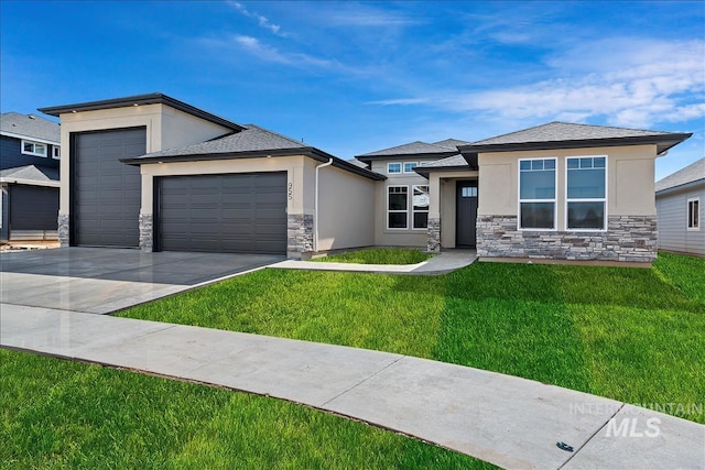 prairie-style home with a garage and a front yard