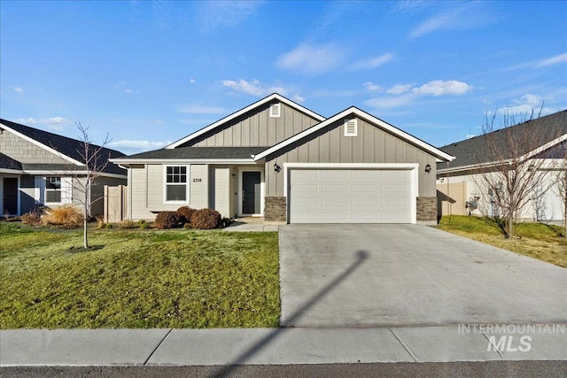 view of front of property with a garage and a front lawn