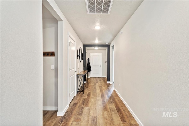 hallway featuring hardwood / wood-style floors