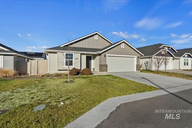 view of front of house featuring a garage and a front yard