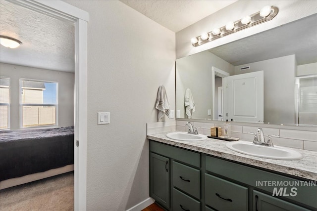 bathroom featuring vanity and a textured ceiling