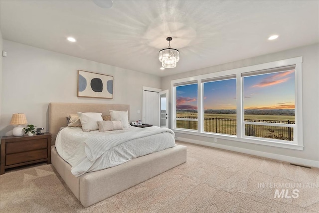 bedroom featuring carpet, visible vents, baseboards, an inviting chandelier, and recessed lighting