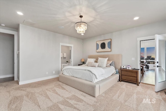 bedroom featuring carpet, baseboards, an inviting chandelier, recessed lighting, and ensuite bathroom