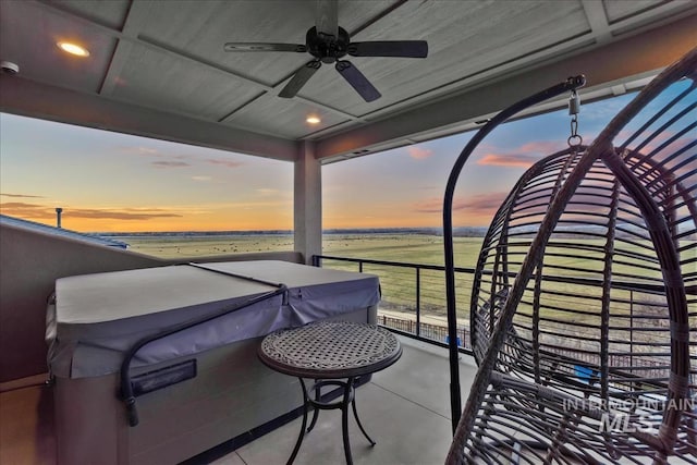 balcony at dusk with a ceiling fan