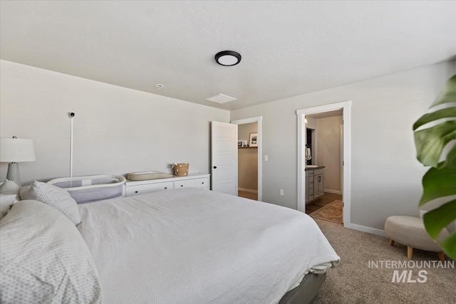 bedroom with light carpet and baseboards