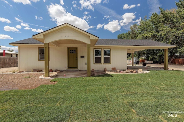 ranch-style home with a front lawn