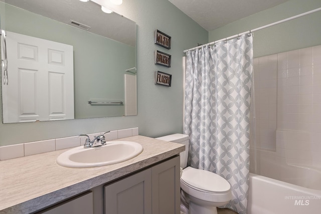 13221 S Clarion River Ave, Nampa, ID 83686 - bathroom featuring toilet, vanity, and shower / tub combo with curtain