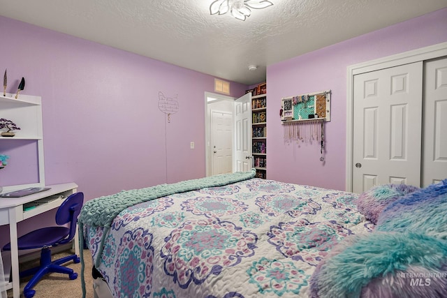 13221 S Clarion River Ave, Nampa, ID 83686 - carpeted bedroom with a closet and a textured ceiling