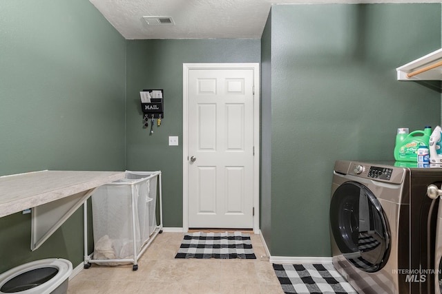 13221 S Clarion River Ave, Nampa, ID 83686 - laundry room with washer / clothes dryer, baseboards, and light tile patterned floors