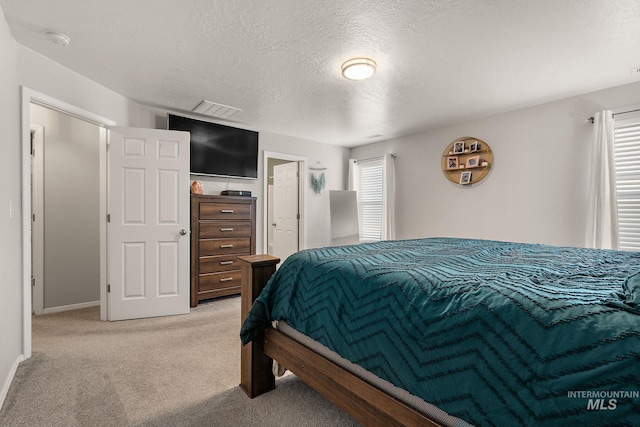 13221 S Clarion River Ave, Nampa, ID 83686 - bedroom with light carpet and a textured ceiling
