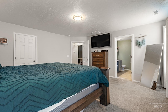 13221 S Clarion River Ave, Nampa, ID 83686 - carpeted bedroom featuring connected bathroom, baseboards, and a textured ceiling