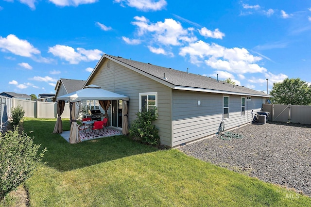 13221 S Clarion River Ave, Nampa, ID 83686 - back of house featuring a gazebo, a patio, a gate, and cooling unit