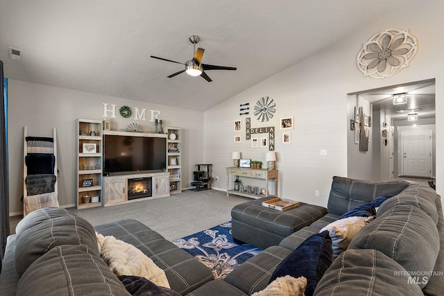 13221 S Clarion River Ave, Nampa, ID 83686 - living area with lofted ceiling, a ceiling fan, carpet, and a glass covered fireplace