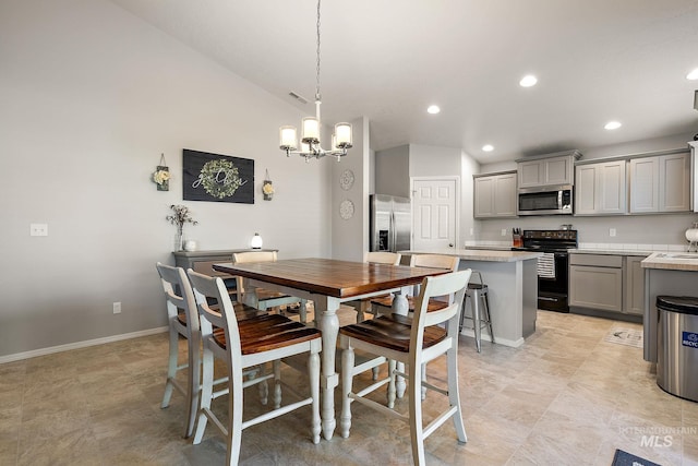 13221 S Clarion River Ave, Nampa, ID 83686 - dining space with recessed lighting, a chandelier, vaulted ceiling, and baseboards