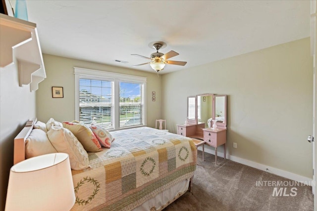 carpeted bedroom with baseboards, ceiling fan, and visible vents